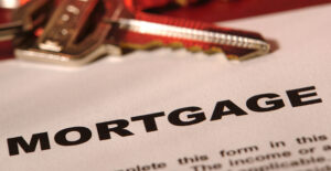 Keys laying on a piece of mortgage paperwork