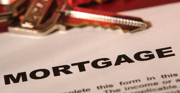 Keys laying on a piece of mortgage paperwork