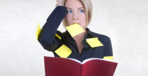 a woman expresses symptoms of anxiety and is covered in post-it notes