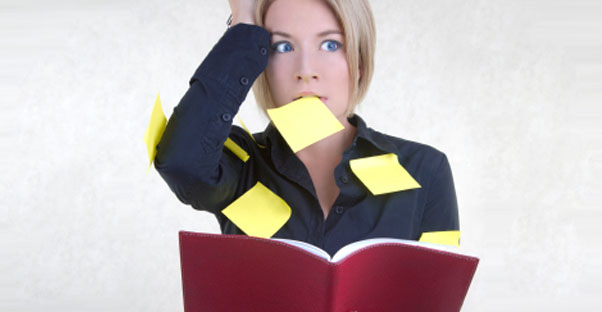 a woman expresses symptoms of anxiety and is covered in post-it notes