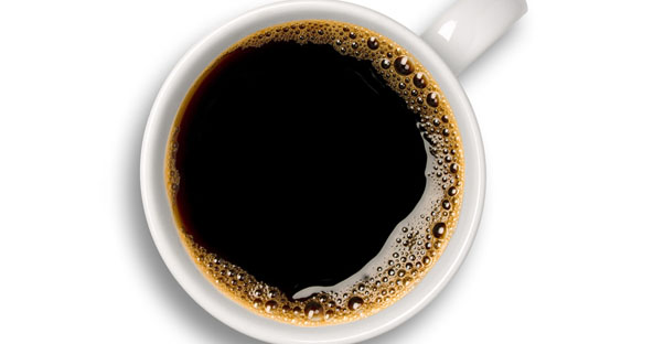 a cup of coffee tempts a caffeine addict