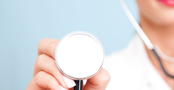 a doctor raises a stethoscope to check cholesterol levels
