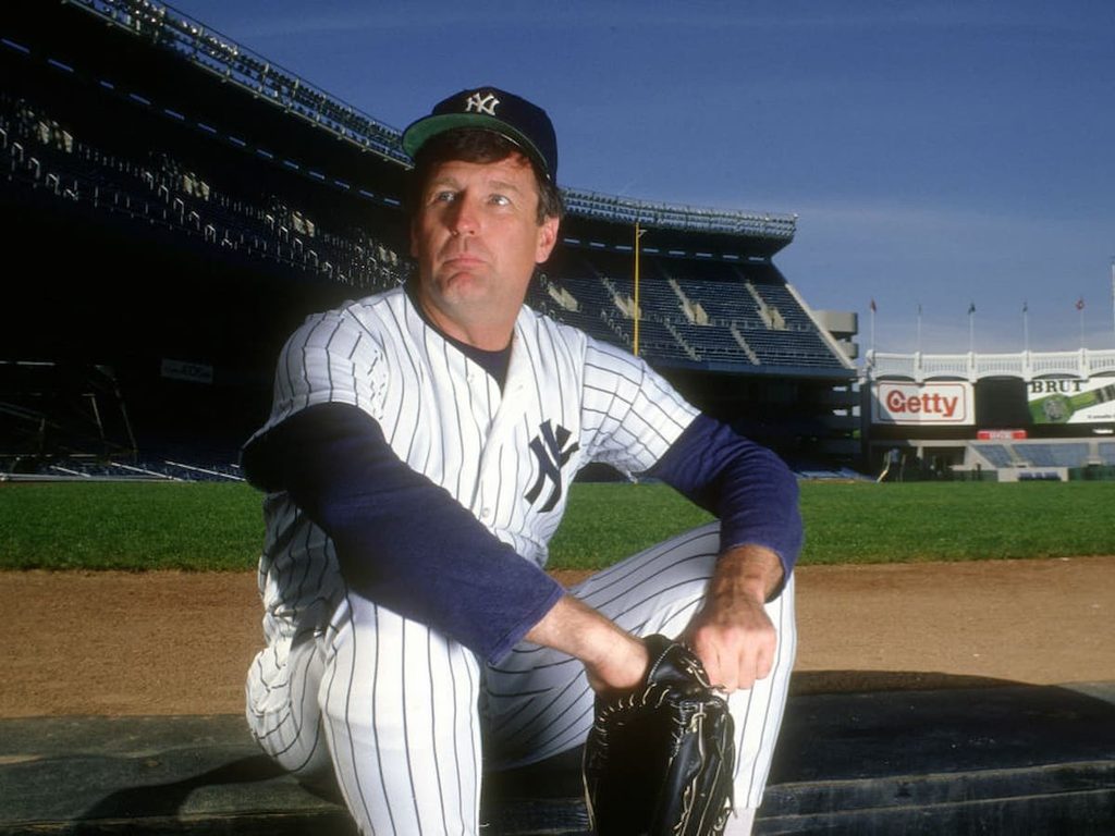 Tommy John in a promotion picture for the New York Yankees before a game in 1987.