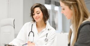 A doctor and patient discuss a laparoscopy