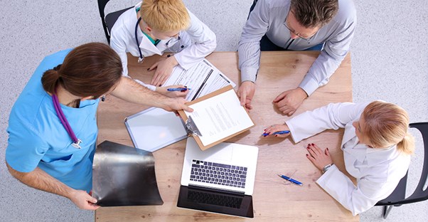 A healthcare team discusses laparoscopies