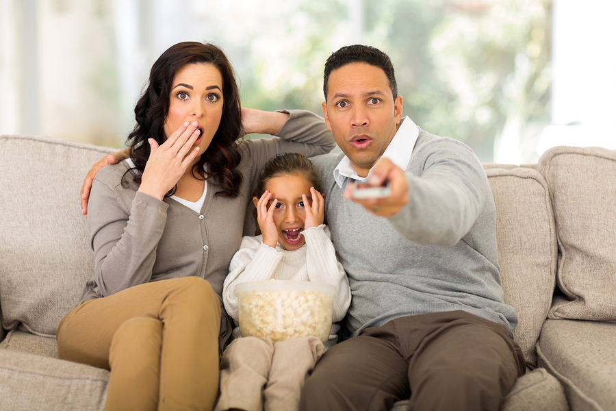 Covering your eyes during scary movie scenes.