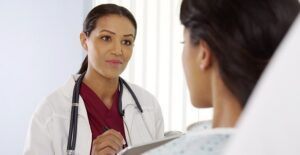 A patient begins her tonsillectomy recovery