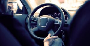 woman driving an affordable luxury car