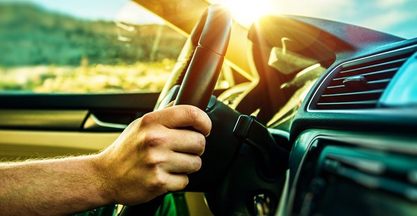 Man driving a new compact SUV
