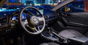 the inside view of the front seat of a compact car