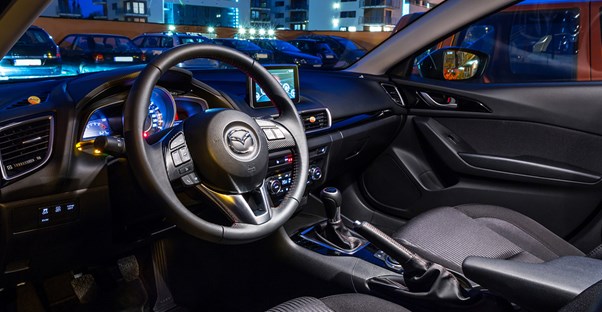the inside view of the front seat of a compact car