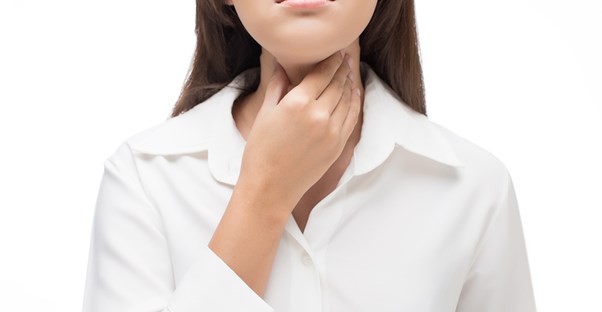 A woman with throat problems