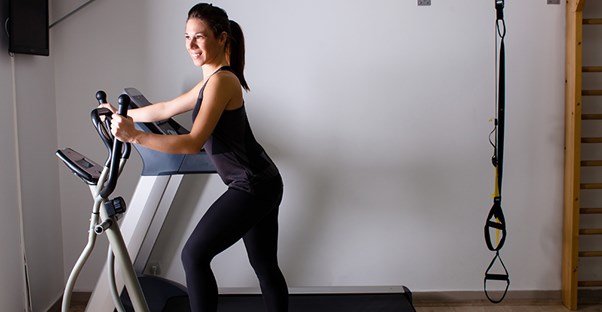 A woman exercises at home