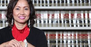 Woman researching immigration lawyers in the library