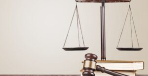 Legal scales next to legal text books