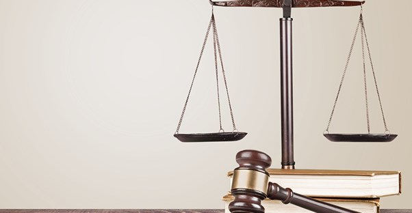 Legal scales next to legal text books