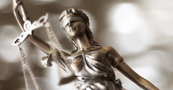 Close up of a scale representing justice
