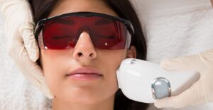 A woman receives facial electrolysis