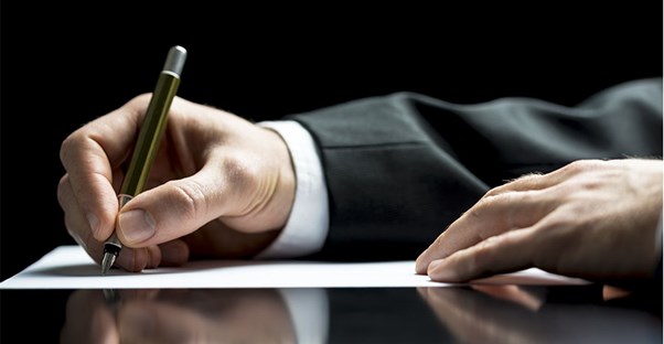 Man writing business letter