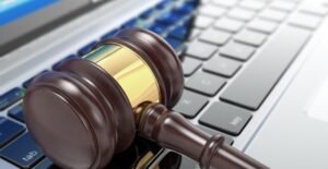 Gavel on top of a computer used to access online government auctions