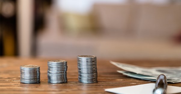 someone struggling to make ends meet counting their change