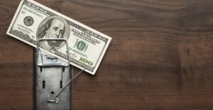 a 100 dollar bill is trapped in a mouse trap