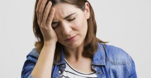 A woman experiences a headache