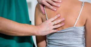 A doctor treats spinal stenosis