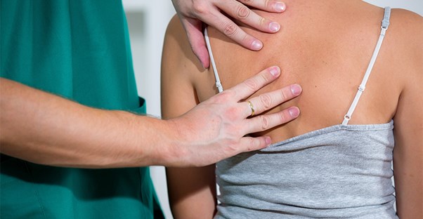 A doctor treats spinal stenosis