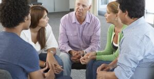 People sitting in circle talking