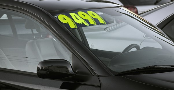 Used car with a price tag in the window