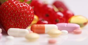 A strawberry and some multivitamins