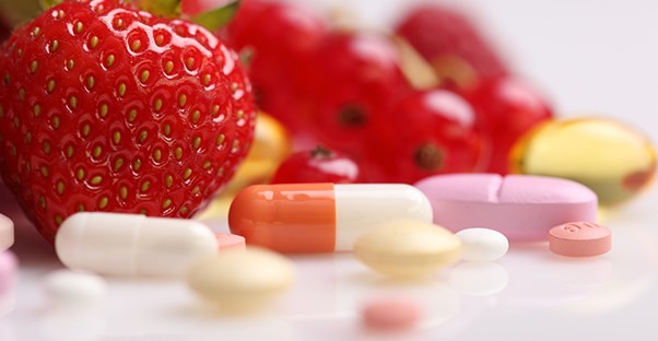 A strawberry and some multivitamins