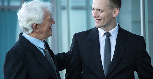 Boss congratulating an engaged employee for a job well done