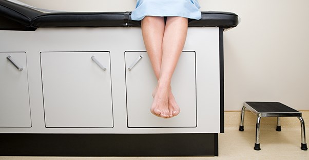 A patient waits in an examination room