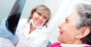 Woman at a dentist appointment paid for by medicare