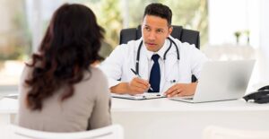 A doctor and patient discuss club foot