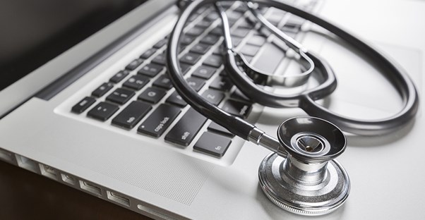 A computer and stethoscope