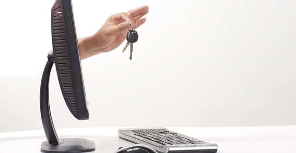 Car keys coming through a computer monitor