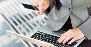business woman researching cell phone plans