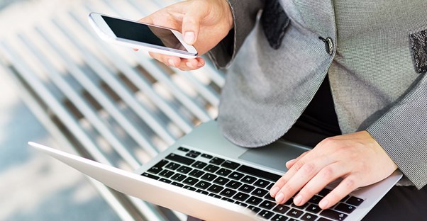 business woman researching cell phone plans