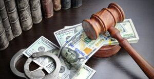 gavel and money with handcuffs to symbolize bail bonds