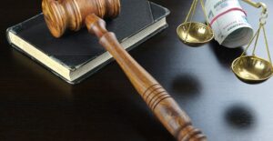 gavel on top of book with scales symbolizing bail bonds