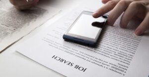 Person using phone to search for job