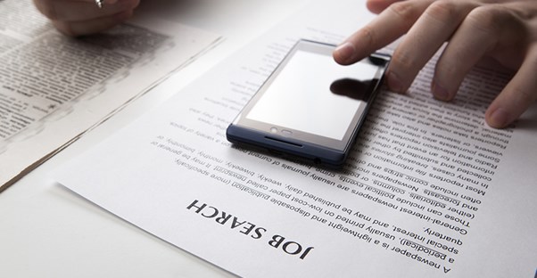 Person using phone to search for job