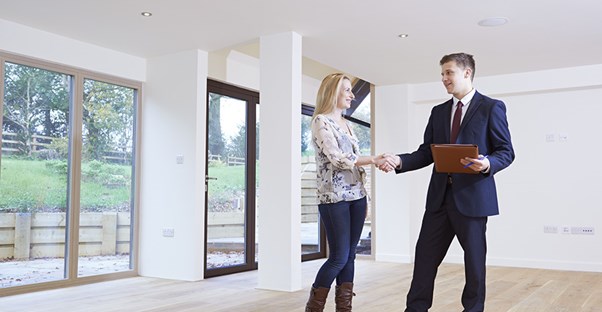 property manager showing apartment to potential tenant