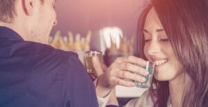 College students taking shots at a party