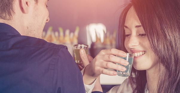 College students taking shots at a party