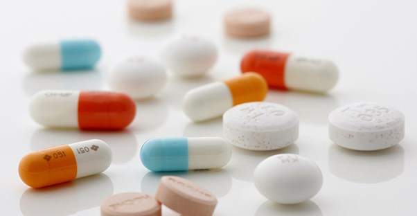 Several different pills on a white background