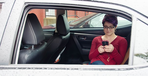 Young professional hides from her boss in her car